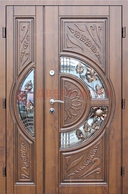 Уличная дверь в цвете Итальянский орех с виноритом и ковкой со стеклом ДВТ-147 в Великом Новгороде